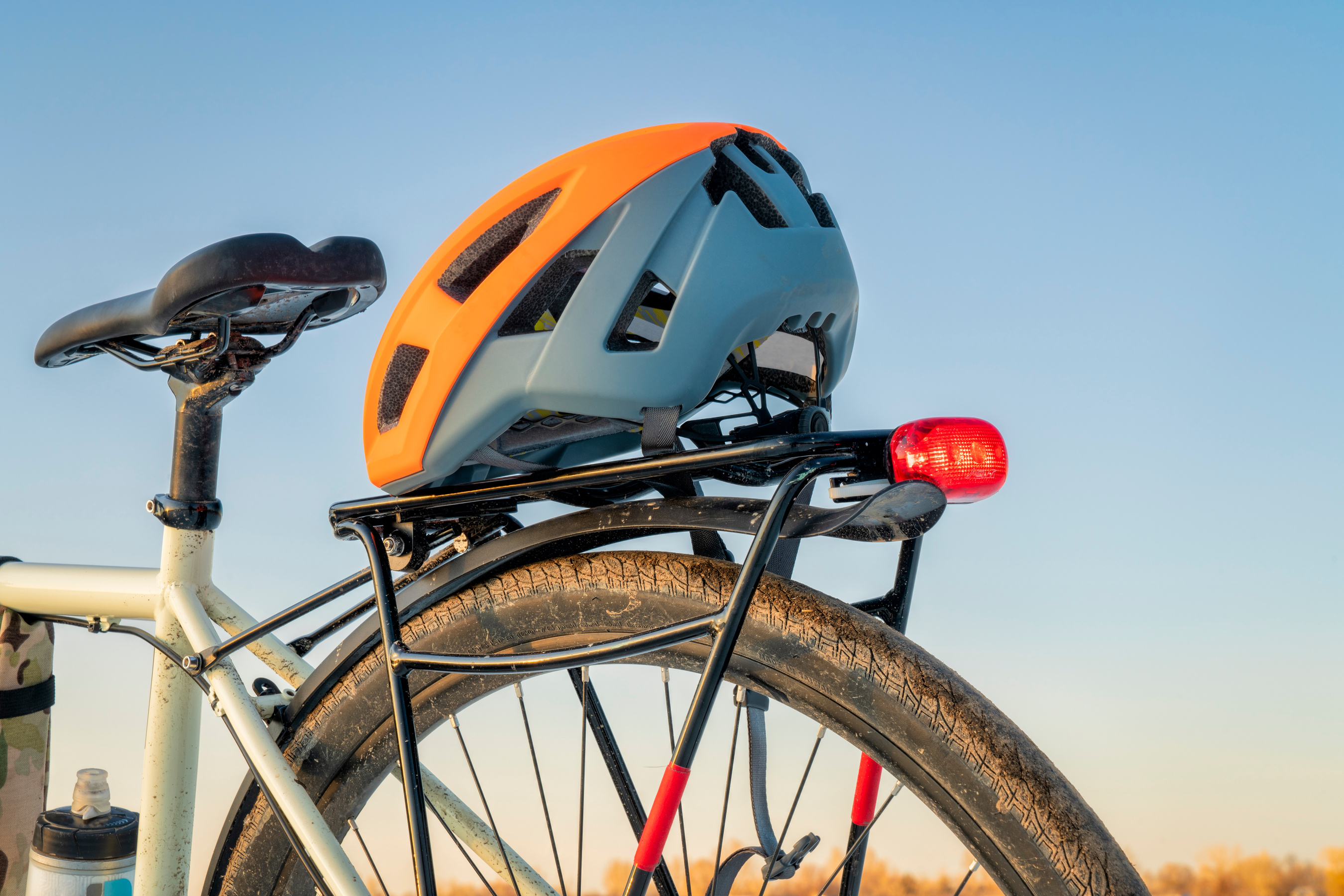 biking helmet on racks of a touring bike